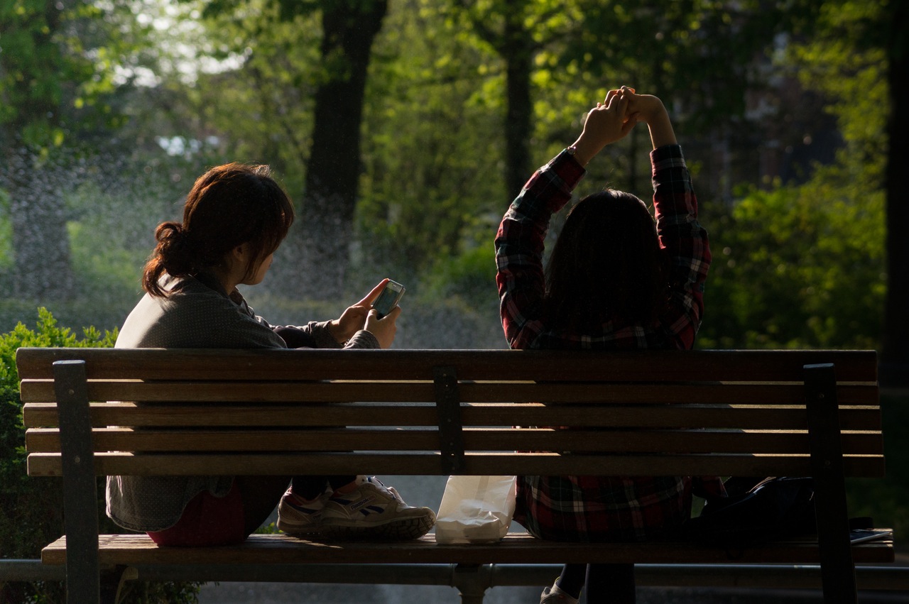 People Using Smartphone And Spend Time With Beach