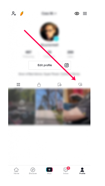 From the profile page, you will see four options under the Edit profile button. Click on the Heart icon with a line through it.