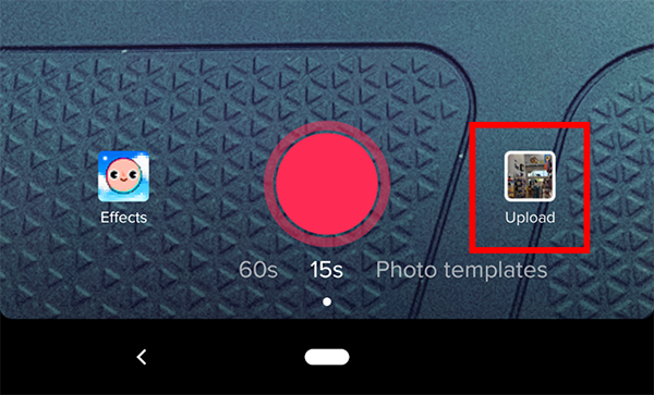 Tap the “Upload” option on the right-hand side of the red record button.