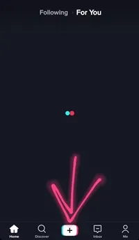Open the Tik Tok app and tap the “+” button which enables you to make a new video.