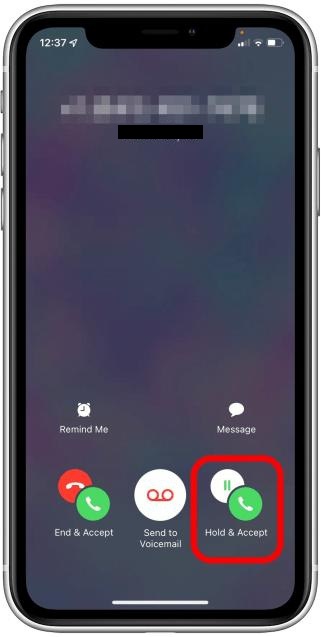 When you receive a call, select Hold & Accept
