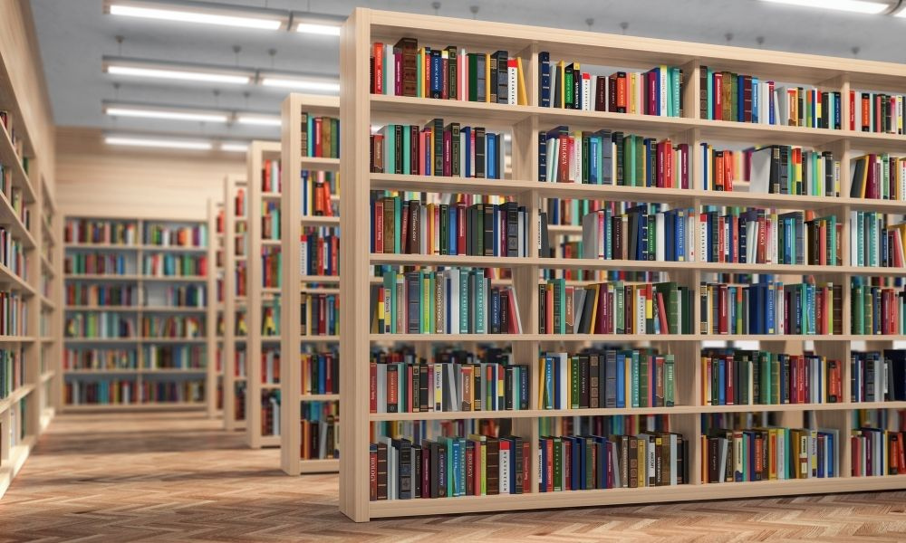 A diverse group of people reading and learning in a modern public library